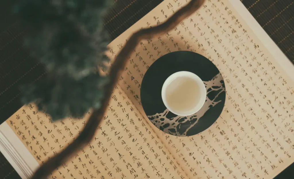 Chinese tea cup on calligraphy paper